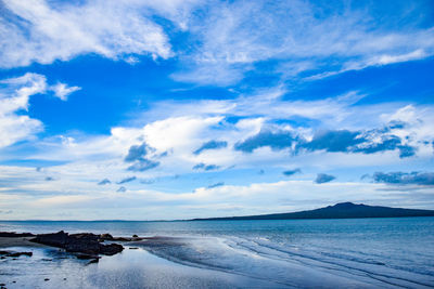 Scenic view of sea against blue sky