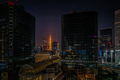 Illuminated buildings in city at night