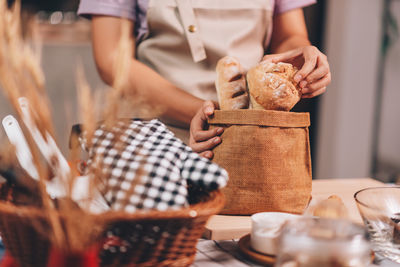 Midsection of man preparing food