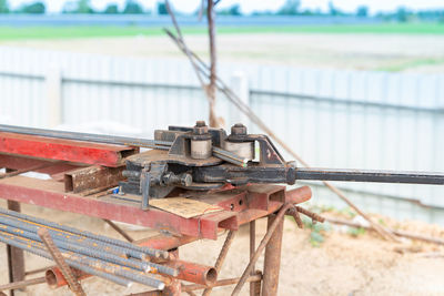 Steel rebar bending by human force in constuction site.