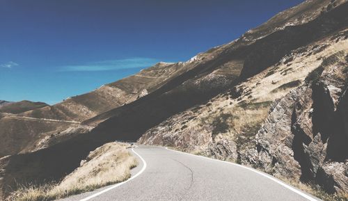 Country road leading towards mountains