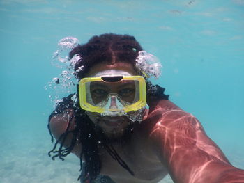 Portrait of man swimming in sea