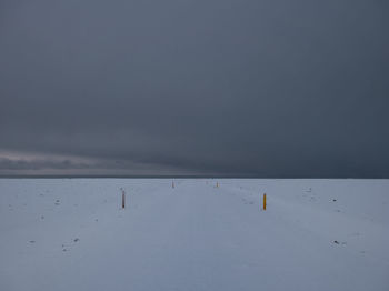 Scenic view of sea against sky during winter