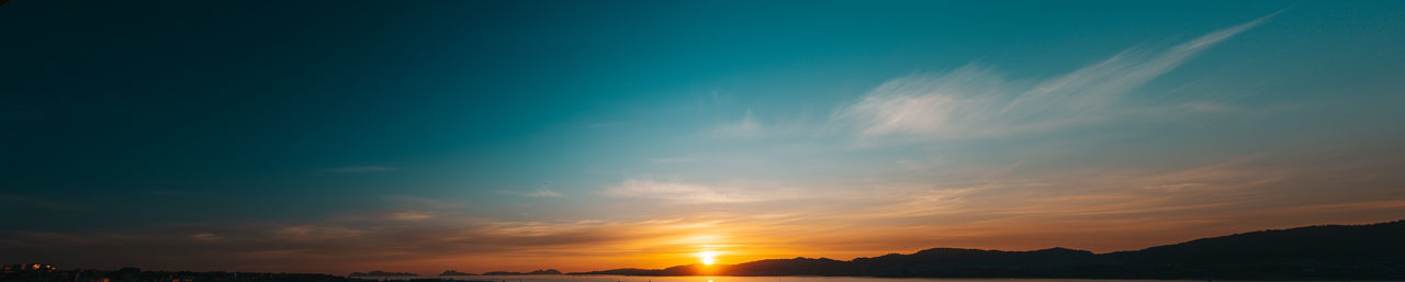 Low angle view of silhouette mountain against sky during sunset