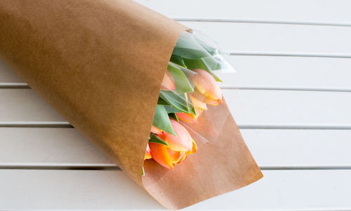 High angle view of bouquet on wooden table