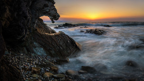 Scenic view of sea against sky during sunset