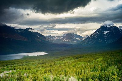 Scenic view of mountains against cloudy sky