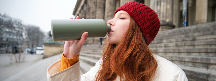 Young woman drinking coffee