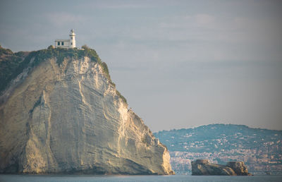 Low angle view of building on rock formation