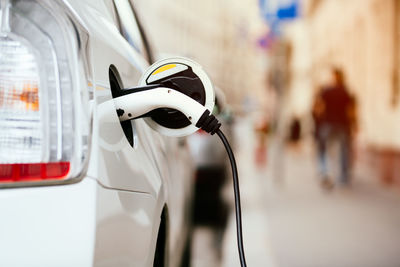 Close-up of electric car being charged