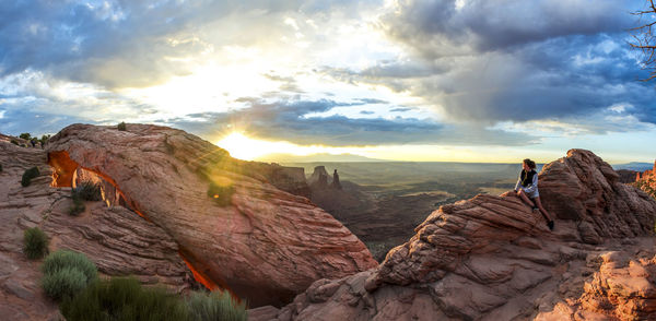 Rock formations on landscape against sky during sunset