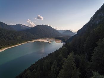 Scenic view of lake and mountains against sky