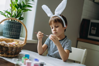 Portrait of young woman using mobile phone