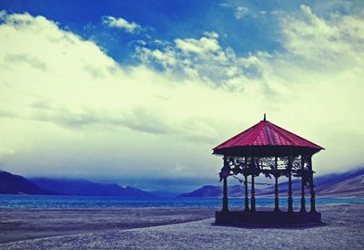 Scenic view of sea against cloudy sky