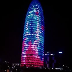 Low angle view of illuminated buildings at night