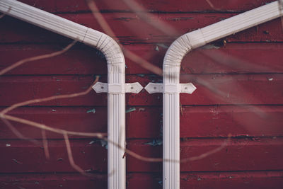 Pipes on red wall