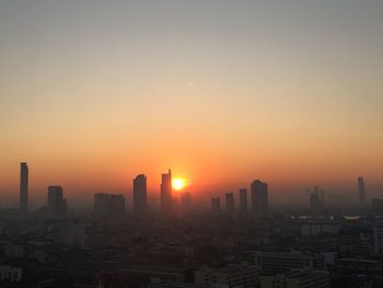 Cityscape against sky during sunrise