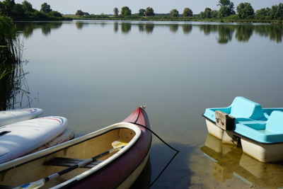 Boats moored in lake