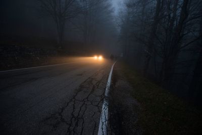 Fog, darkness and cold, walking on a mountain road