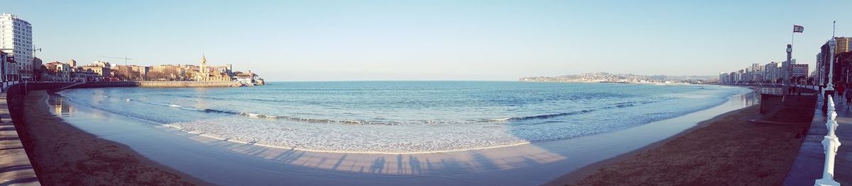 Panoramic view of sea against clear blue sky