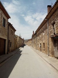 Road leading towards buildings