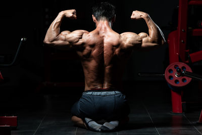 Low section of man exercising in gym