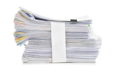 Stack of books on white background