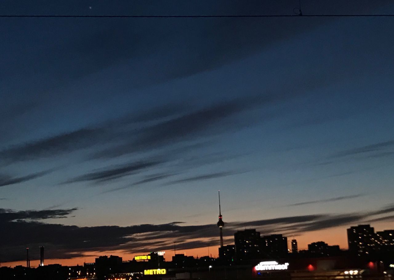 city, architecture, building exterior, sky, built structure, outdoors, night, illuminated, no people, travel destinations, modern, cloud - sky, dramatic sky, cityscape, urban skyline, skyscraper, star - space