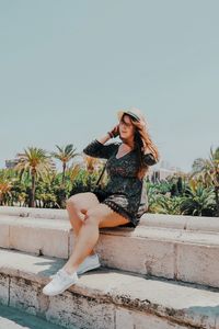 Woman wearing hat against clear sky