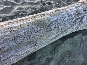 High angle view of text on sand at beach