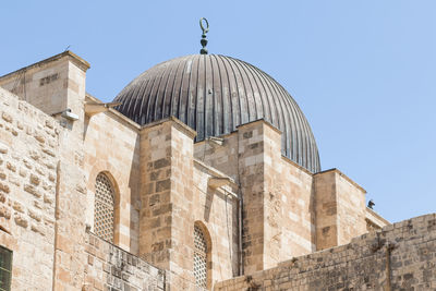 Low angle view of historical building against clear sky