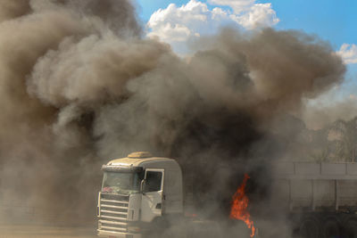 Close-up of smoke emitting from truck in flames