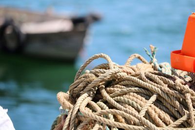 Close-up of rope tied on wooden post