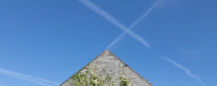 Low angle view of building against blue sky