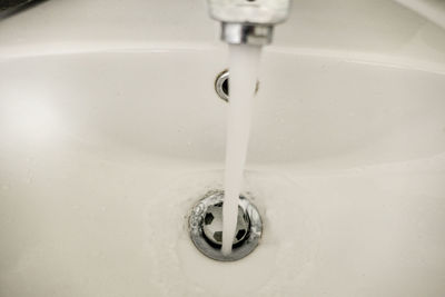 Close-up of faucet in bathroom