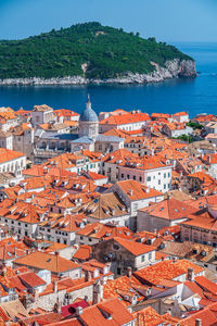 High angle view of townscape by sea