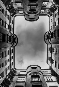 Low angle view of building against cloudy sky
