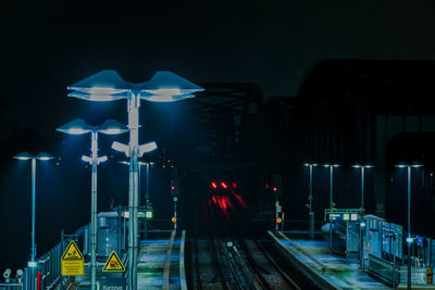 Illuminated street lights at night