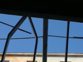 Low angle view of blue sky seen through window