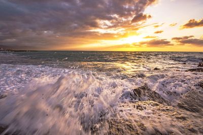 Scenic view of sea against sky during sunset