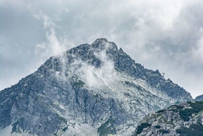 Low angle view of majestic mountain against sky