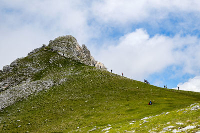 Low angle view of rocks against sky