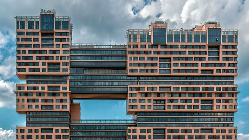 Low angle view of modern buildings against sky