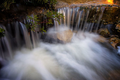Close-up of waterfall against blurred background