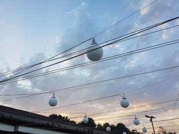 Low angle view of street light against sky