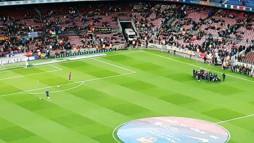 People playing soccer on field