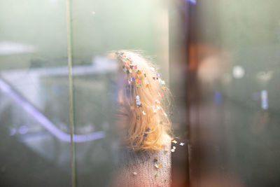 Portrait of woman with confetti in hair