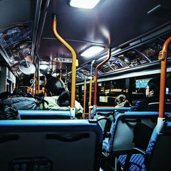 Rear view of people sitting in bus