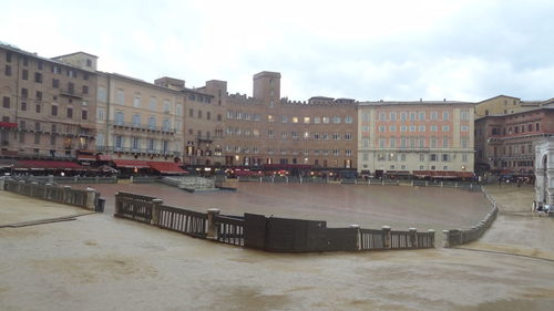 Buildings in city against sky