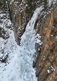 An ice climber in hyalite canyon near bozeman, montana. 